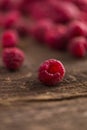 Fresh Organic Raspberries on wood surface