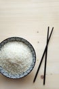 A bowl of fresh organic white Rice with Chinese sticks Royalty Free Stock Photo