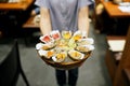 A bowl of Fresh Oyster topped with sea urchin roe uni, salmon roe ikura, wagyu beef, marinated egg yolk and spicy seafood Royalty Free Stock Photo