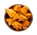 Bowl with fresh raw pumpkin pieces isolated on white