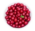 Bowl of fresh red cherries and green leaf isolated on a white background top view Royalty Free Stock Photo