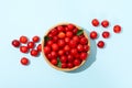 Bowl with fresh red cherry on background, top view Royalty Free Stock Photo