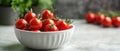 Bowl of Fresh, Red Cherry Tomatoes on a Gray Surface Royalty Free Stock Photo
