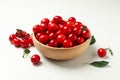 Bowl with fresh red cherry on background, close up Royalty Free Stock Photo