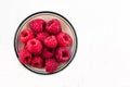Bowl of Red Raspberries against a white background Royalty Free Stock Photo