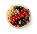 Bowl with fresh red, white and black currants isolated on white, top view Royalty Free Stock Photo