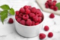 Bowl with fresh ripe raspberries on marble table, closeup Royalty Free Stock Photo