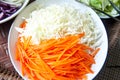 Bowl with fresh slice carrot and Chinese cabbage Royalty Free Stock Photo