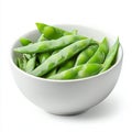 A bowl of fresh snow peas, isolated on a white background, emphasizing Royalty Free Stock Photo