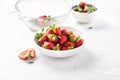 Bowl of fresh strawberries white background Royalty Free Stock Photo