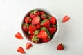 Bowl with fresh strawberries on white background, space for text. Summer sweet fruits Royalty Free Stock Photo