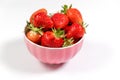 Bowl with fresh strawberries on a white background. Summer composition Royalty Free Stock Photo