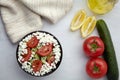 Bowl of fresh vegetable salad on white wooden table Royalty Free Stock Photo