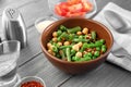 Bowl with fresh vegetable salad on wooden table. Diet food Royalty Free Stock Photo