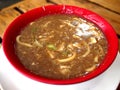 Bowl of freshly cooked fat egg noodles in thick soup Royalty Free Stock Photo