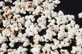 a bowl of freshly cooked popcorn on a black background, popcorn texture Royalty Free Stock Photo