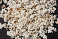 a bowl of freshly cooked popcorn on a black background, popcorn texture Royalty Free Stock Photo