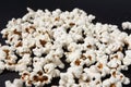 a bowl of freshly cooked popcorn on a black background, popcorn texture Royalty Free Stock Photo