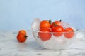 Bowl with frozen cherry tomatoes and ice cubes Royalty Free Stock Photo