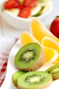 Bowl with fruit salad - pieces of orange, banana, strawberry and kiwi Royalty Free Stock Photo