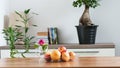 a bowl of fruit on a table in a home setting Royalty Free Stock Photo