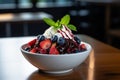 a bowl of fruit and whipped cream