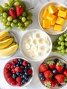 A bowl of fruit and yogurt with bananas, strawberries, and blueberries Royalty Free Stock Photo