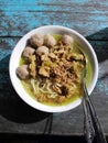 a bowl full of chicken noodle and meatball Royalty Free Stock Photo