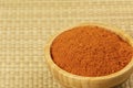 Bowl full of Chili Powder on a bamboo background