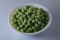Bowl full of frozen green peas Royalty Free Stock Photo