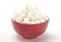 Bowl Full of Mini White Marshmallows on a White Background Royalty Free Stock Photo