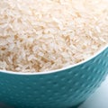 Bowl full of rice on white background.  Close-up. Copy-space. Ingredient for a healthy diet. Royalty Free Stock Photo