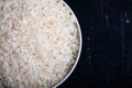 Bowl full of rice on white background.  Close-up. Copy-space. Ingredient for a healthy diet. Royalty Free Stock Photo