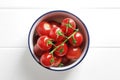 Bowl full of ripe fresh cherry tomatoes on wooden Royalty Free Stock Photo