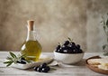Bowl full of selected olives and glass decanter of extra virgin olive oil stand on rural wooden table. Stone wall in Royalty Free Stock Photo