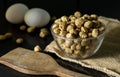 a bowl full of soya bean chunks and eggs on black background Royalty Free Stock Photo