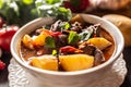 Bowl of goulash stew with meat, potatoes, chillies and parsley Royalty Free Stock Photo