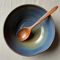 Bowl with a gradient of blue and earthy tones placed on a textured Royalty Free Stock Photo