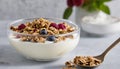 A bowl of granola and berries with a spoon Royalty Free Stock Photo