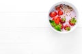 Bowl of granola with strawberries, textspace left, topview Royalty Free Stock Photo