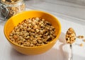 A bowl of granola on a white wooden background Royalty Free Stock Photo