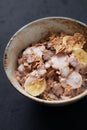 Bowl of granola with yogurt and banana. Concept for a tasty and healthy meal.