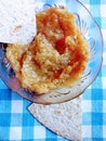 A bowl of Greek Eggplant Salad with a piece of Whole Wheat Tortilla