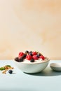 A bowl of Greek yogurt topped with granola, mixed berries, and a drizzle of honey Royalty Free Stock Photo