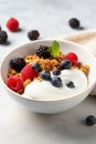 A bowl of Greek yogurt topped with granola, mixed berries, and a drizzle of honey Royalty Free Stock Photo