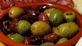 Bowl with green and black olives and herbs Royalty Free Stock Photo