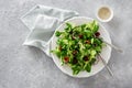 Bowl of green salad with mache leaves and baked tomatoes copy space top view Royalty Free Stock Photo