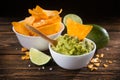 Bowl with guacamole sauce and nachos chips