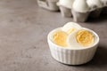 Bowl with hard boiled eggs on table.