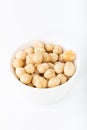Bowl with hazelnuts over white background Royalty Free Stock Photo